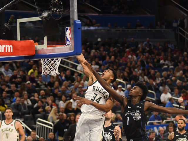 Milwaukee Bucks player dunking a basketball for two points