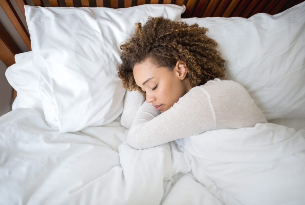 woman sleeping on amerisleep as3 mattress