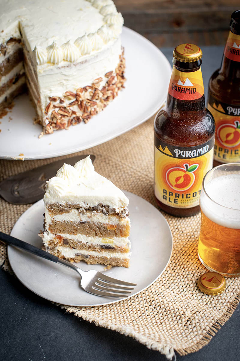 How fruit beer makes the perfect secret ingredient in carrot cake Closeup shot of a homemade, 4 layer apricot-ale carrot cake made with Pyramid's apricot ale and a pineapple creamcheese frosting.