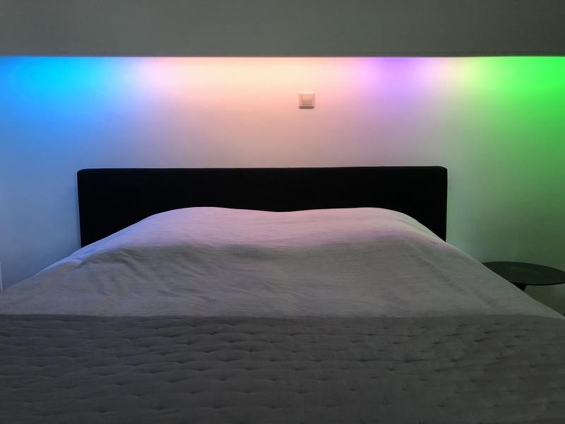 A LED strip above my bed showing different segments, bounded by colors