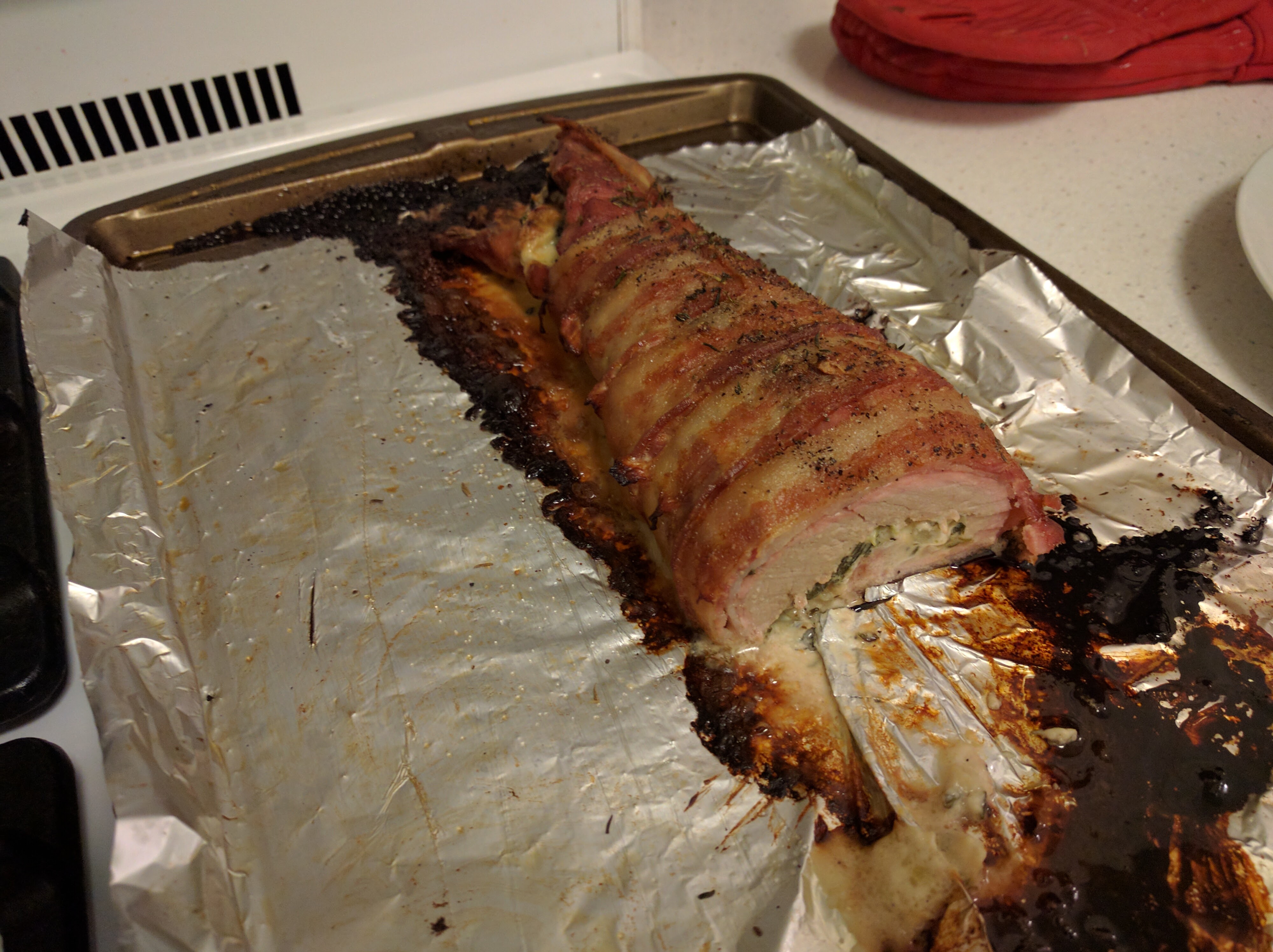 Finished pork tenderloin on baking sheet