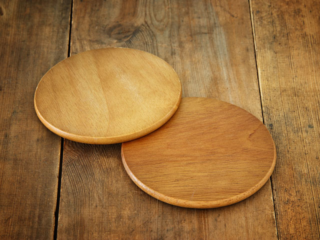 A pair of wooden beer coasters