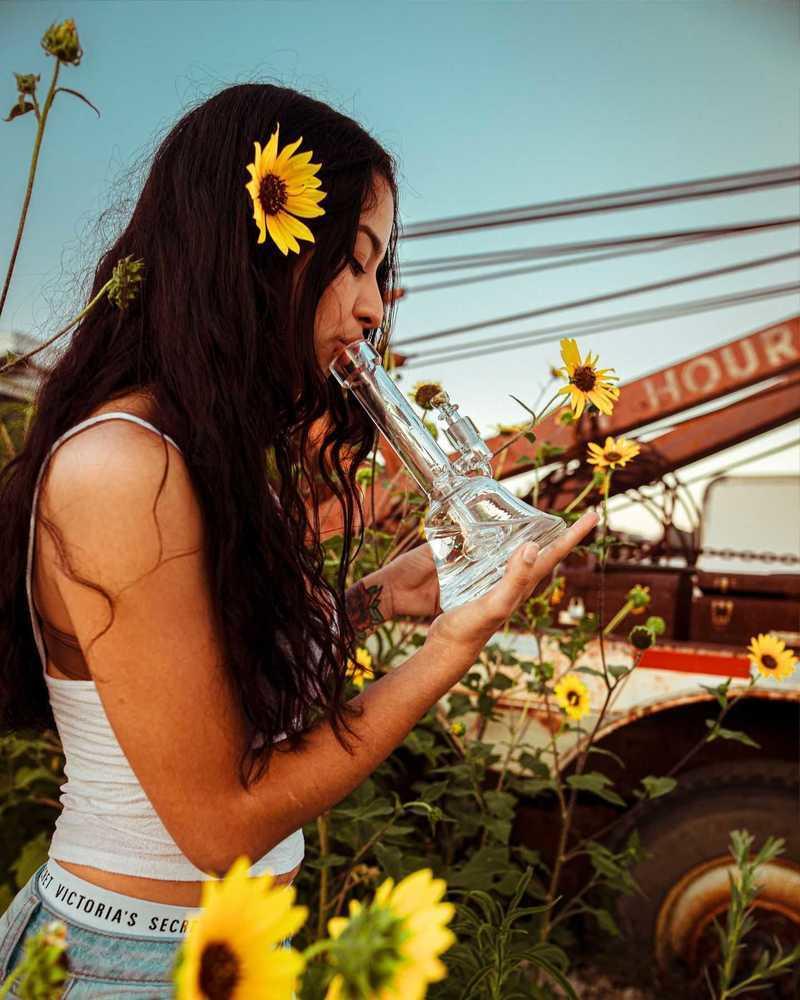 Girl smoking weed from a bong