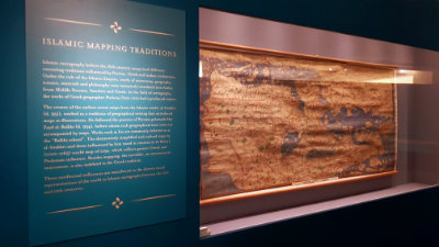 A gallery section titled: 'Islamic Mapping Traditions' with a large map on display.