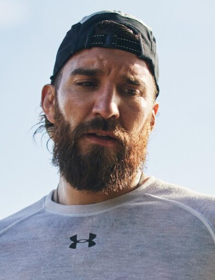 bearded man in under armour clothing