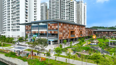 A photograph of Northshore Plaza, a three-story shopping mall in Punggol. Its façade is painted brown and beige.
