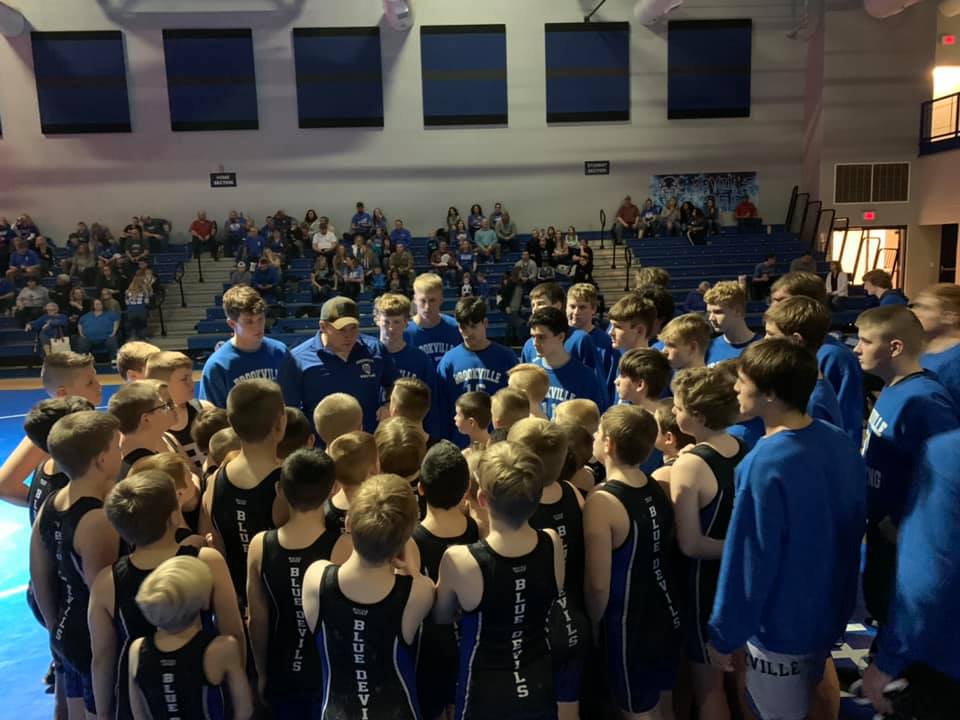 Youth wrestling team gathered with the high school team