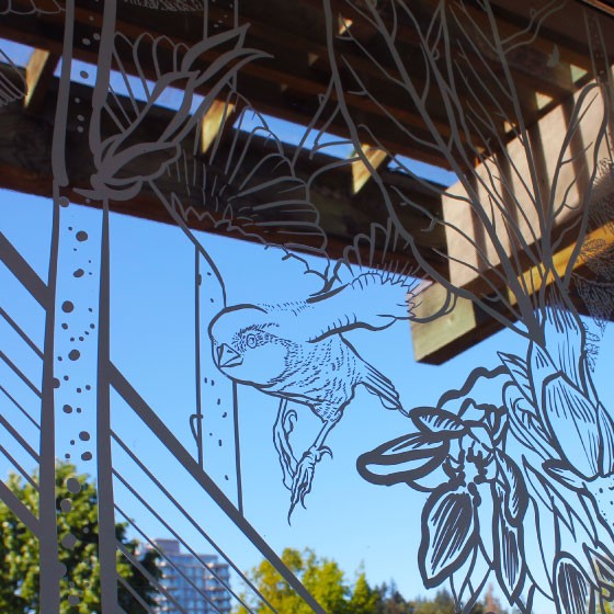 A detail of a windows at the UBC Botanical Gardens, which have been covered in artistic decals to prevent birds from flying into them