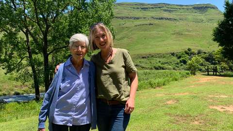 My mum and sister standing on the lawn outside the cottage in the Drakensberg mountains.