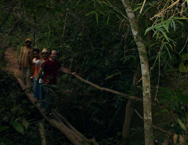 The author (front) treks with Bakairí Indians through the jungle along the same route that Fawcett followed eighty years earlier.