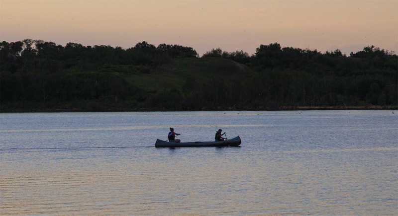 Two people canoeing on a Saskatchewan lake