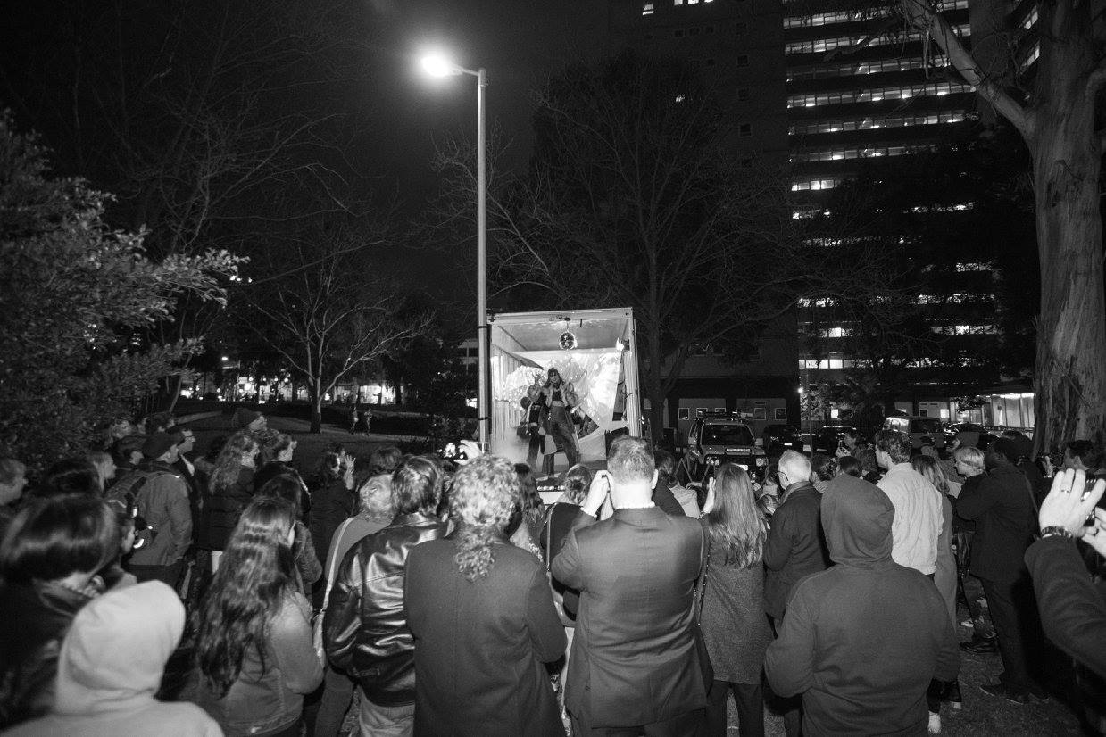 The crowd at 2017's projection festival at a performance from the back of a MWAV truck.