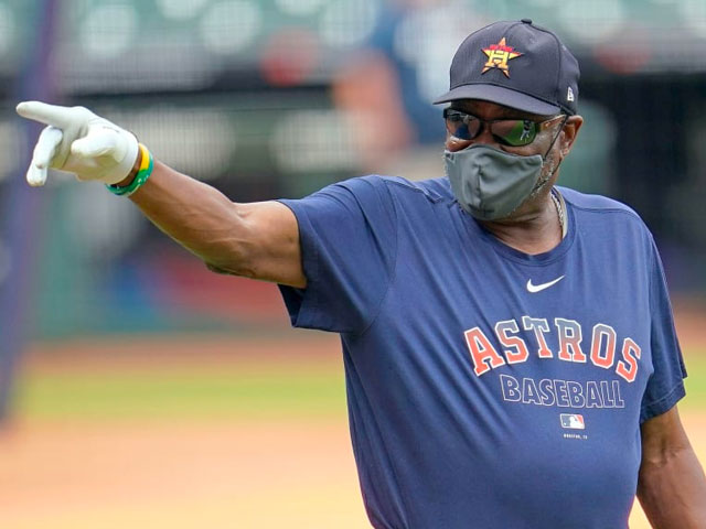 Dusty Baker wearing a mask and gloves