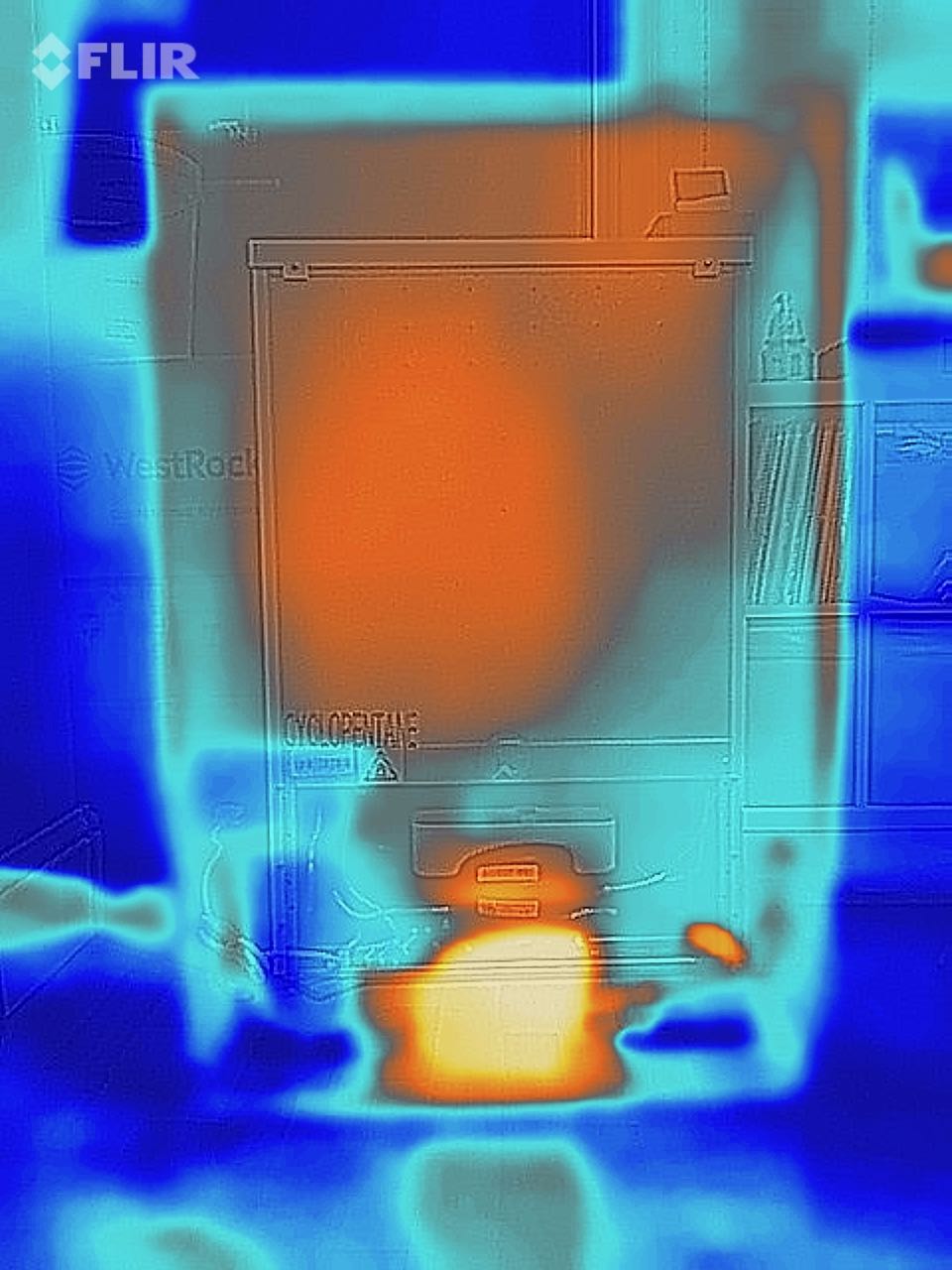 A thermal image showing the hump at the back of a fridge giving off
    heat