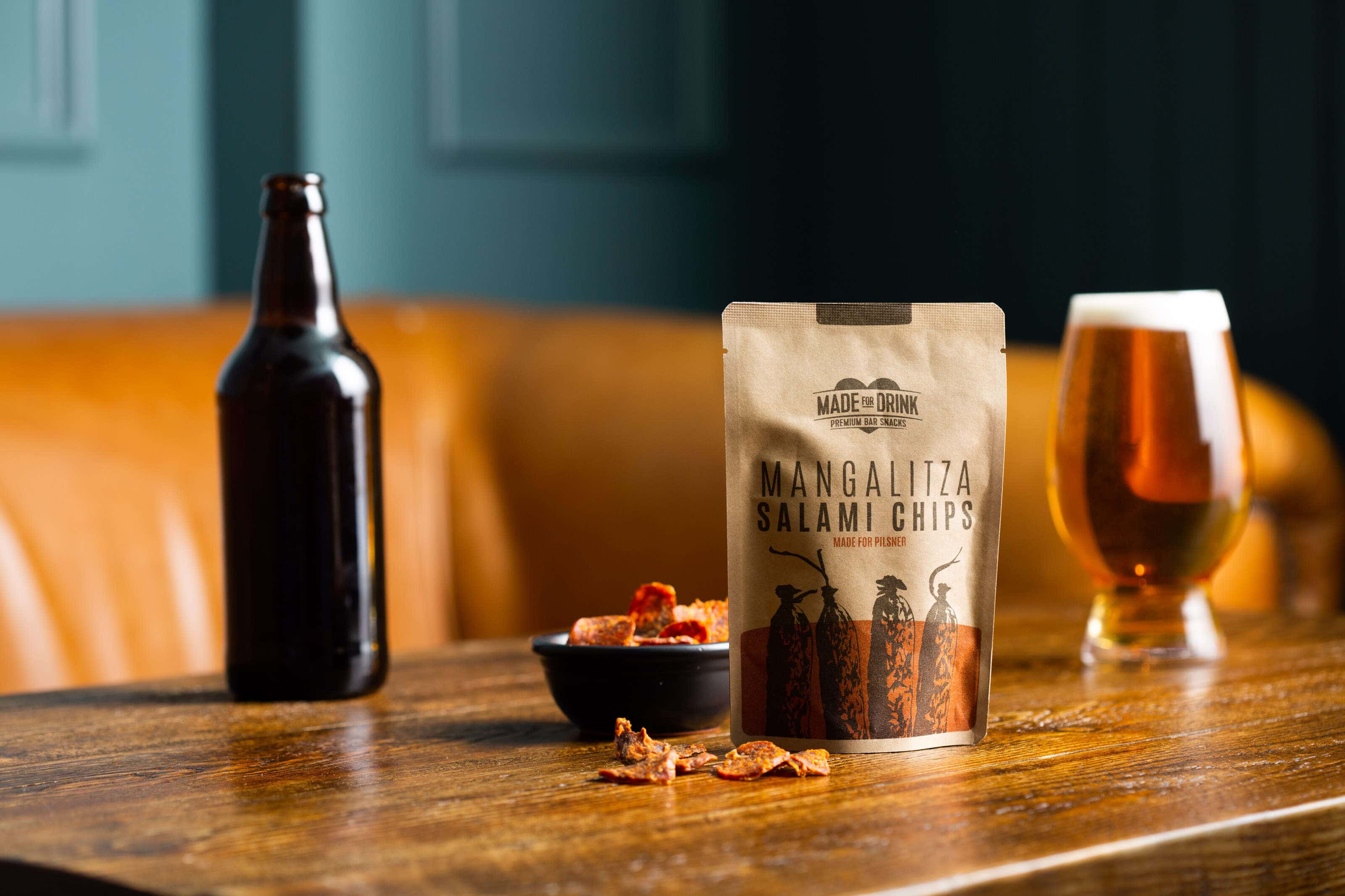 beer and salami snacks on a pub table