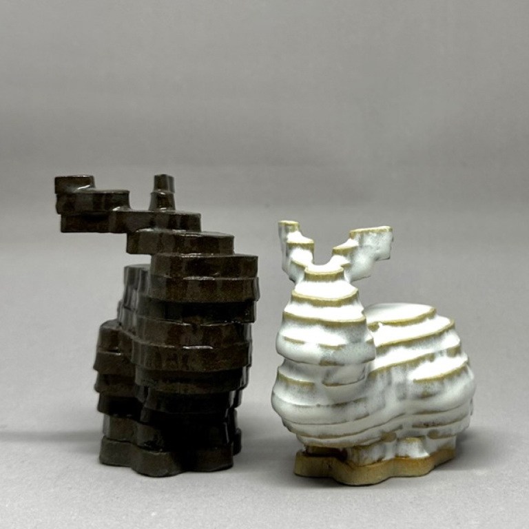 two ceramic bunnies mimicking a 3D-printed style