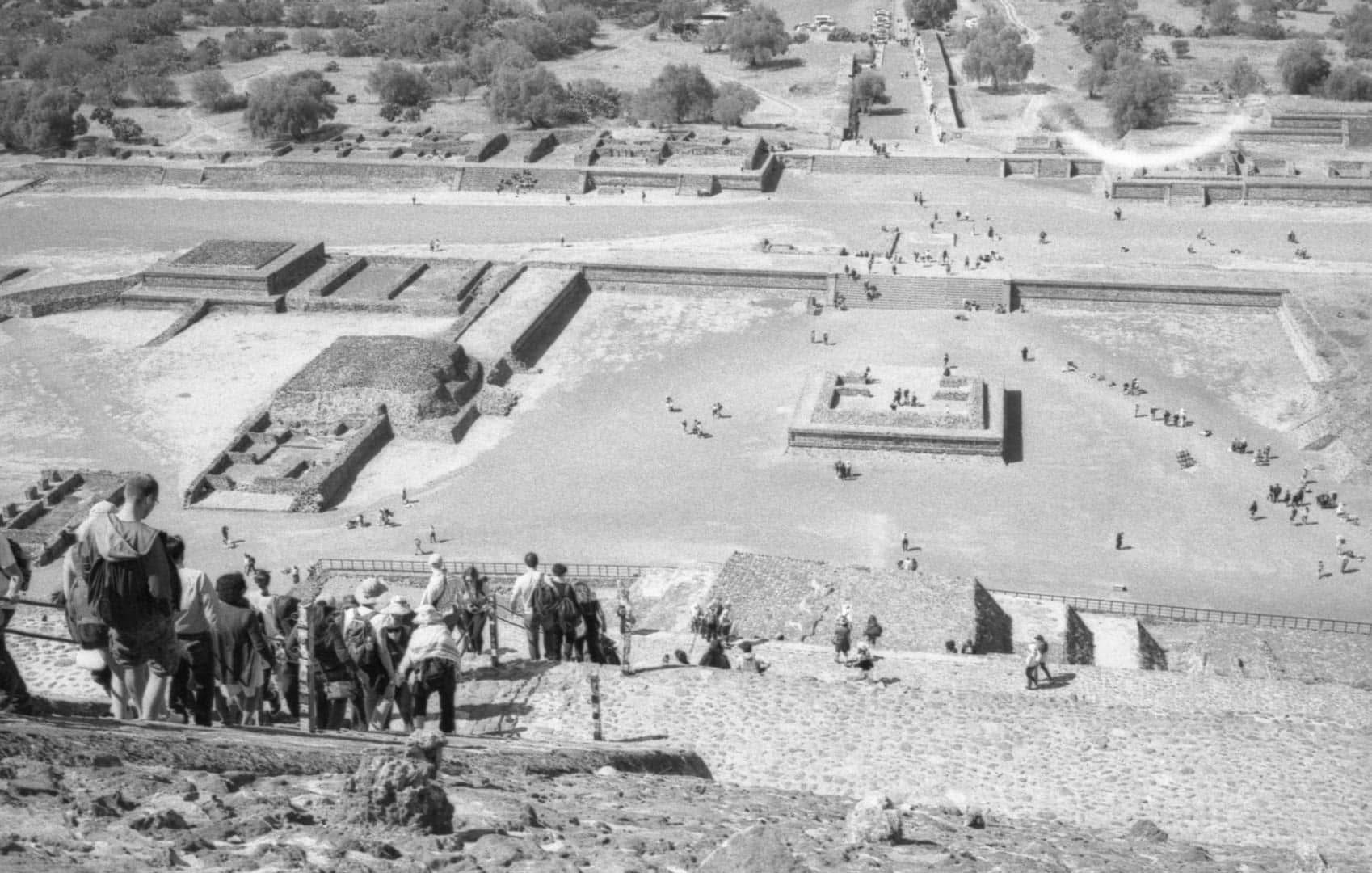 A stream of people walking down a pyrimid at Teotihuacan