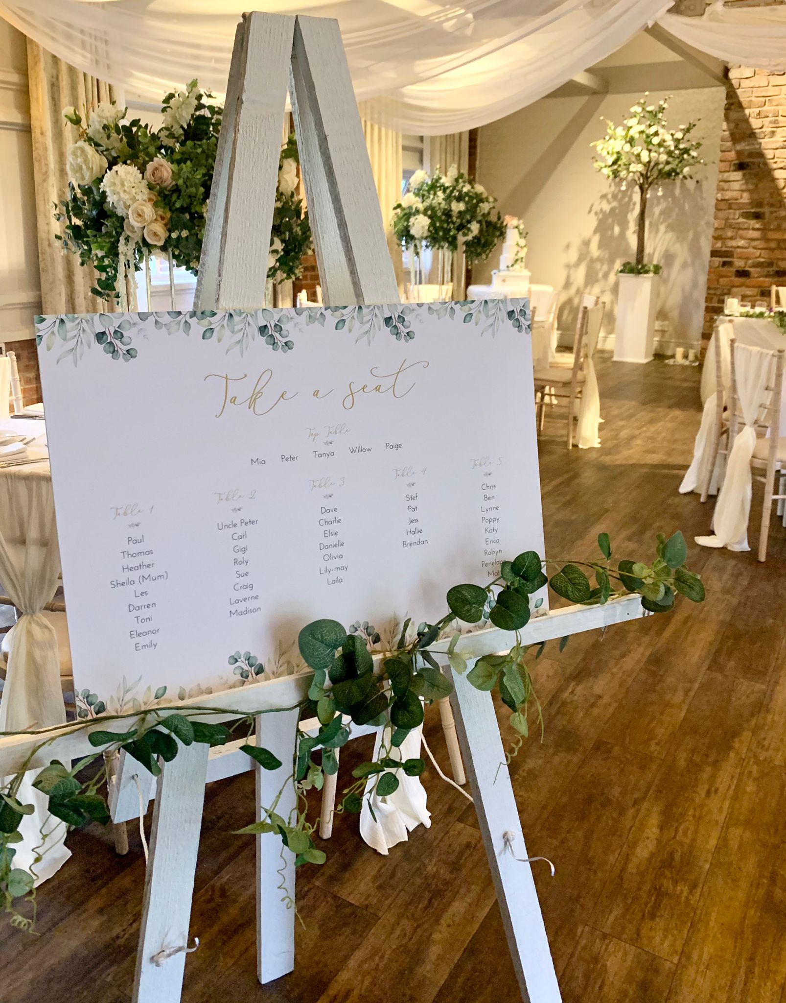 easle with wedding guests table names