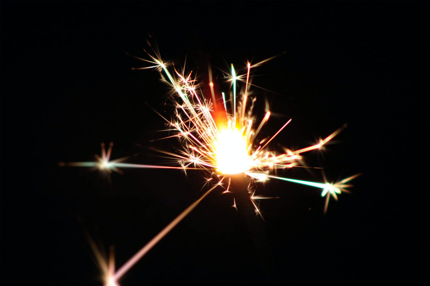 firework exploding in dark sky