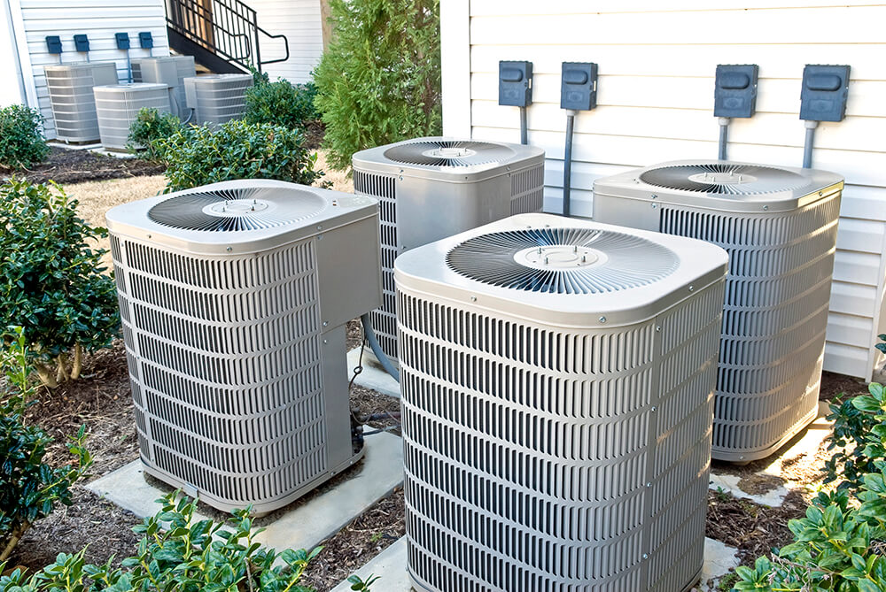 Photo of four exterior AC units
