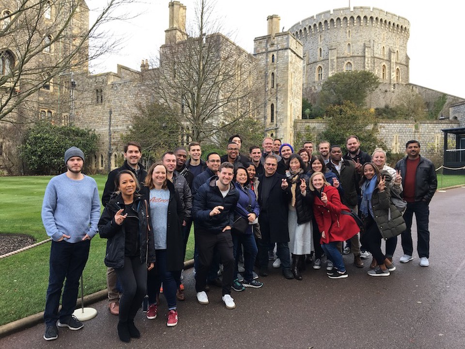 Linda Kao with SMU Cox Online MBA students and faculty outside a castle on a day trip during the London Online MBA Immersion in December 2019.