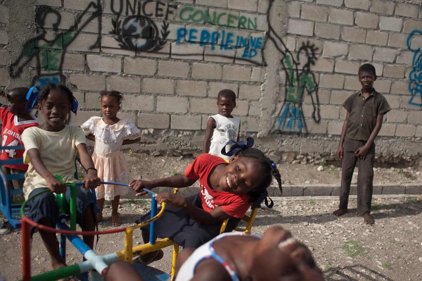 Children playing together outside as part of a Concern program