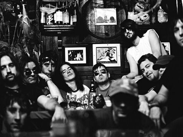 Bang Camaro's musicians and choir members hanging out a a bar