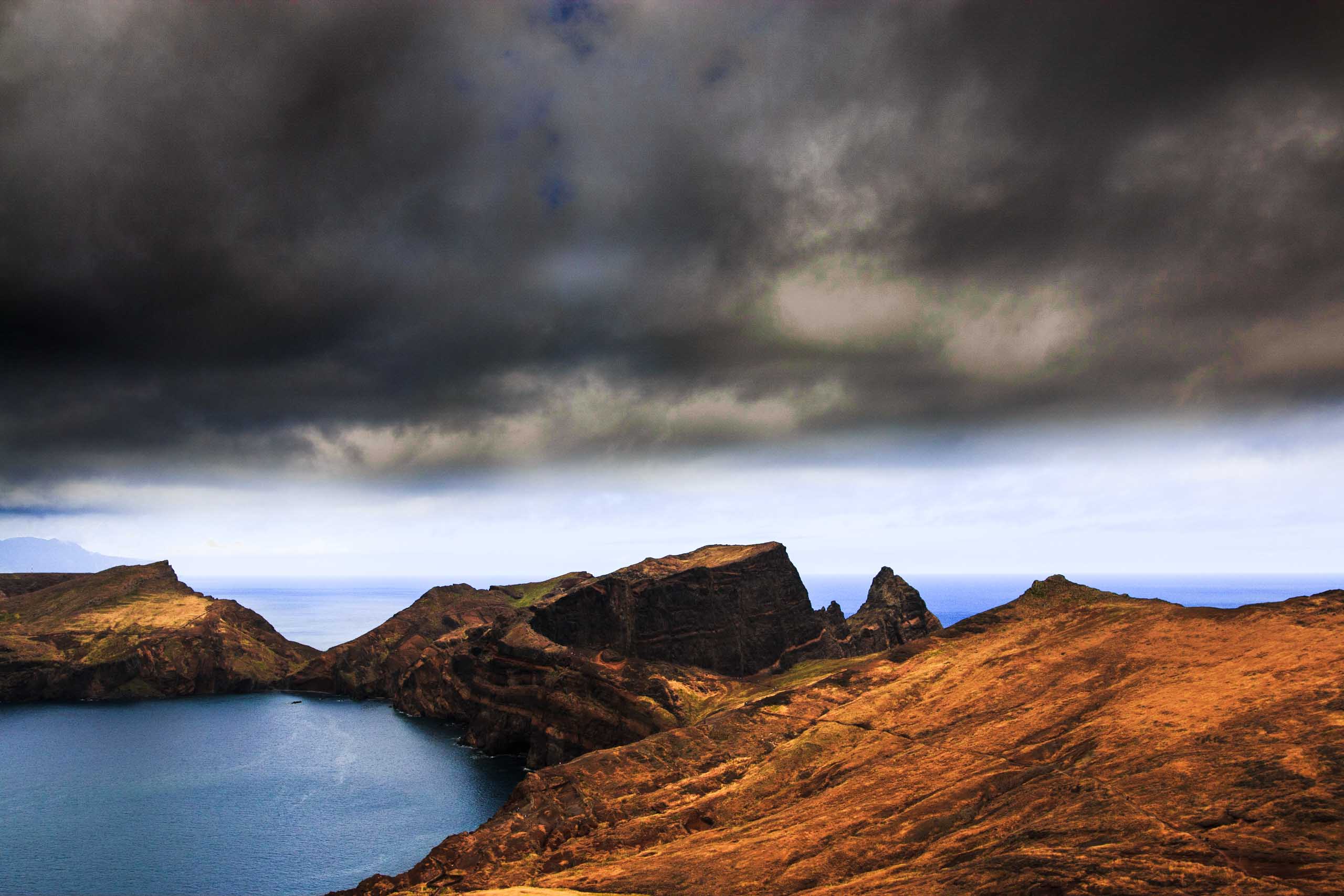 Near black rain clouds in a coast landscape.