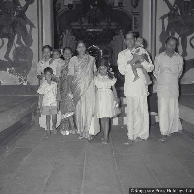 Hindu family at a temple for prayers during Deepavali, 1956