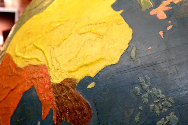 A detail of the globe, with its ridges and contrasting color scheme shown in detail.
