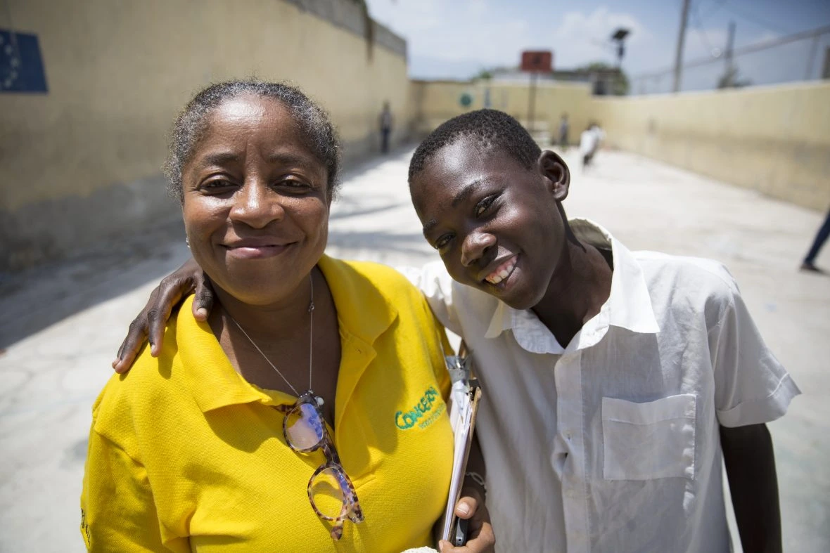 Concern’s Marie Stanise Mendes with Ricardo Joseph from Cité Soleil, who took part in a summer camp run by Concern.