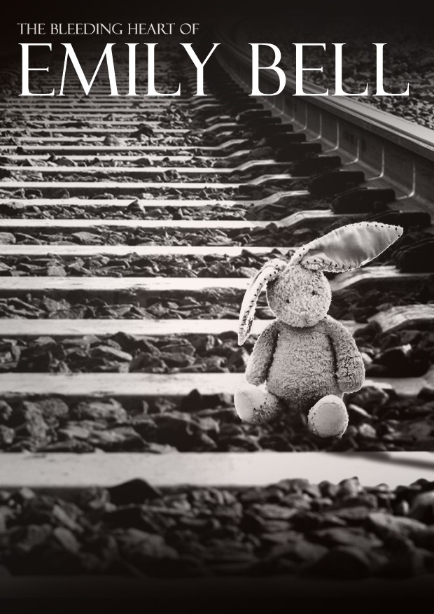 A rabbit teddy on the railway tracks