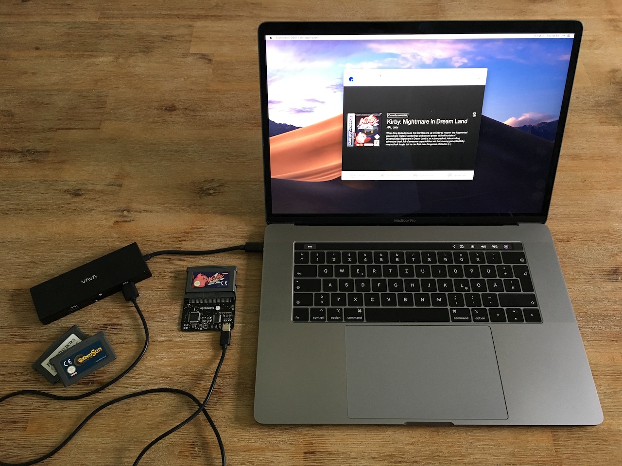 The GB01 Cart Reader connected to my computer on which you can see the software dumping the rom of Kirby: Nighmare In Dream Land
