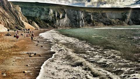 Waves breaking on the beach at The Needles, Isle of Wight.