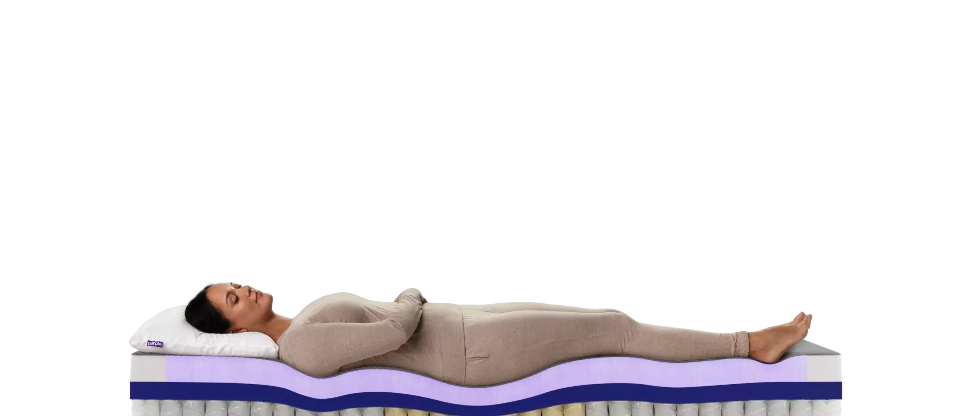 A woman sleeping on Purple RestorePlus hybrid mattress