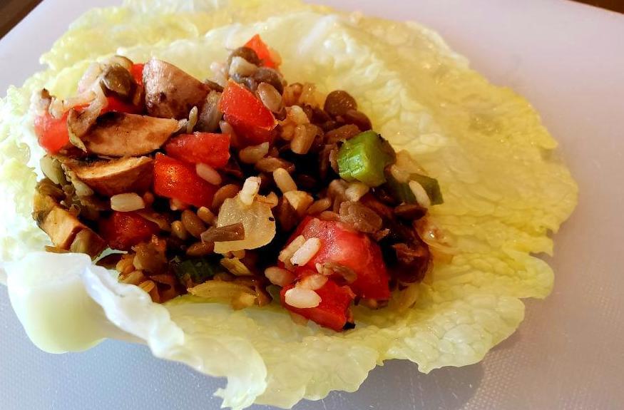 Cabbage leaf with lentil, rice filling on top