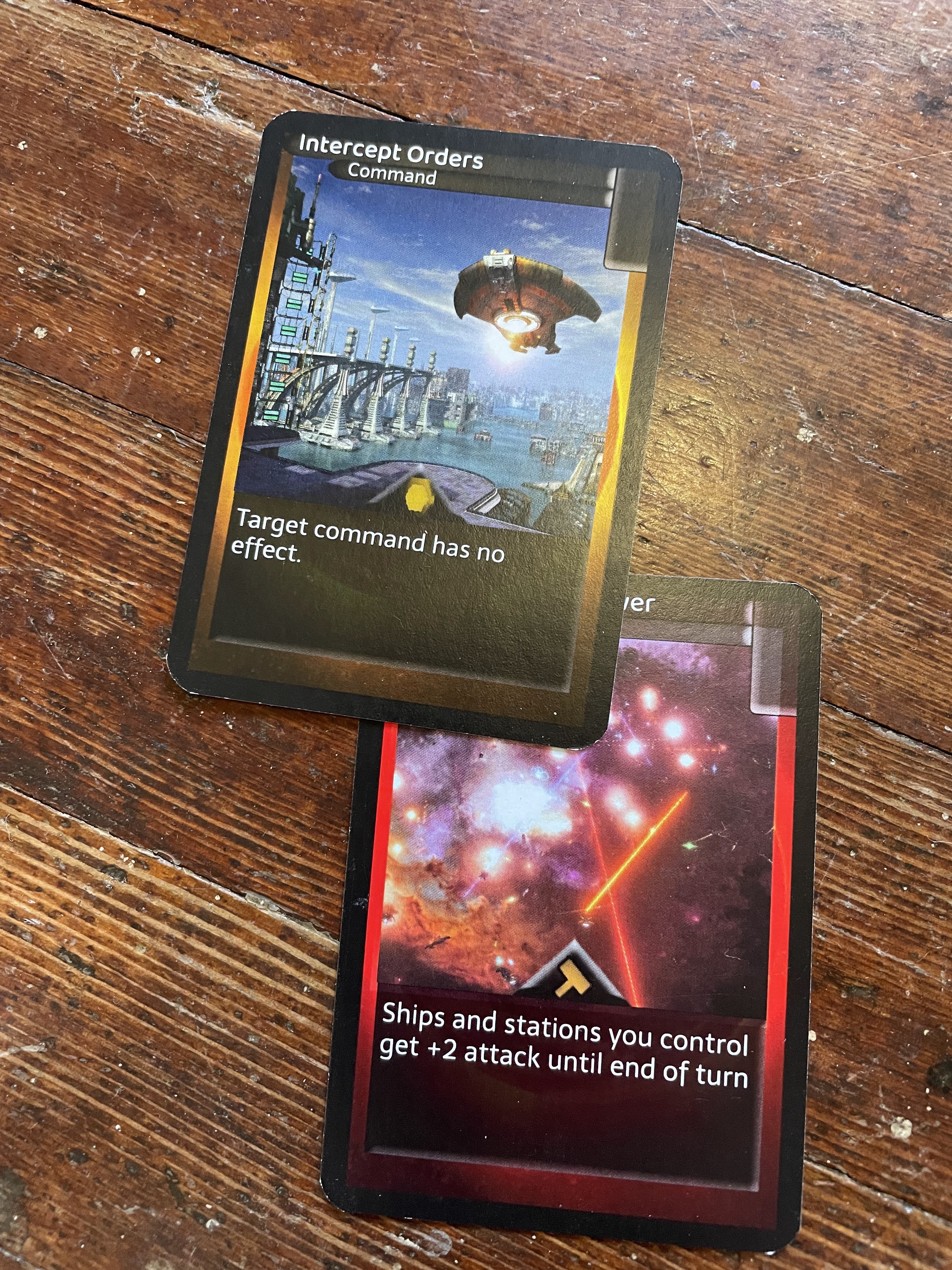 Intercept Orders, a Politics card, is placed on top of Maximum Firepower, an Industry card.