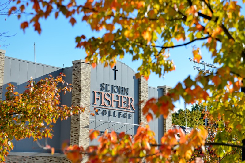 Image of St. John Fisher building with colorful leaves around it