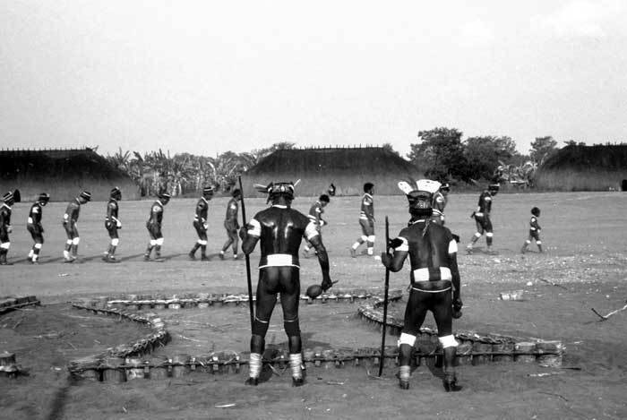 Kuikuro Indians participate in one of their most sacred rituals, the Kuarup, which honors the dead.