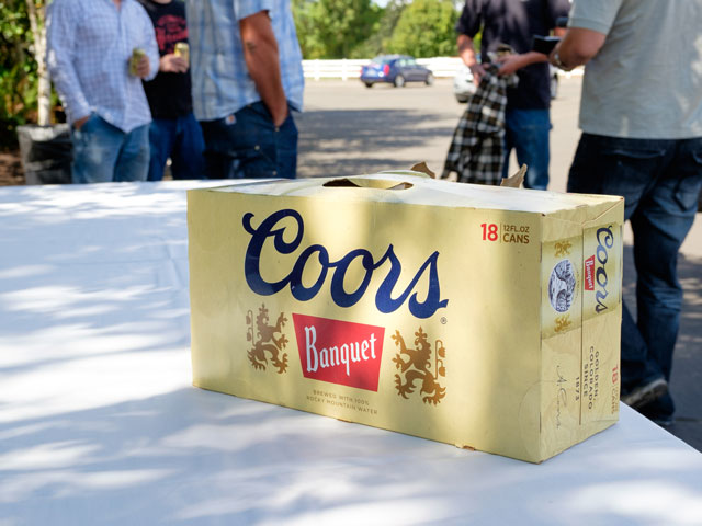 A case of Coors Banquet beer on a table at a party