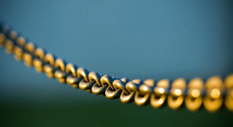 Optional Chaining in JS Golden chain against the sky