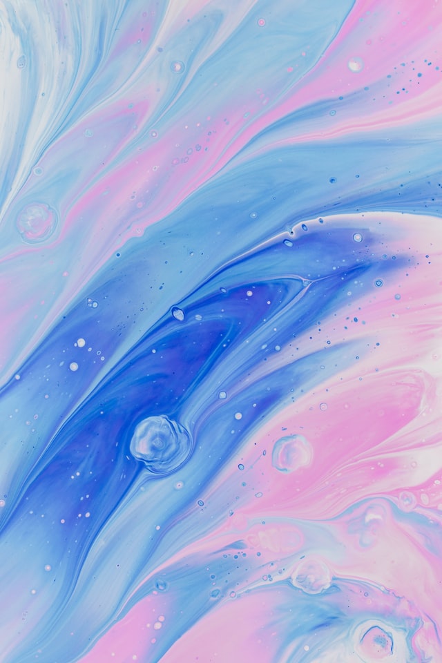 Texture image from Unsplash comprising of pinks, purples and light blue swirls