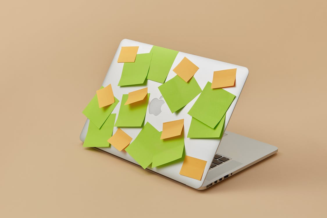 Laptop with sticky notes on the back