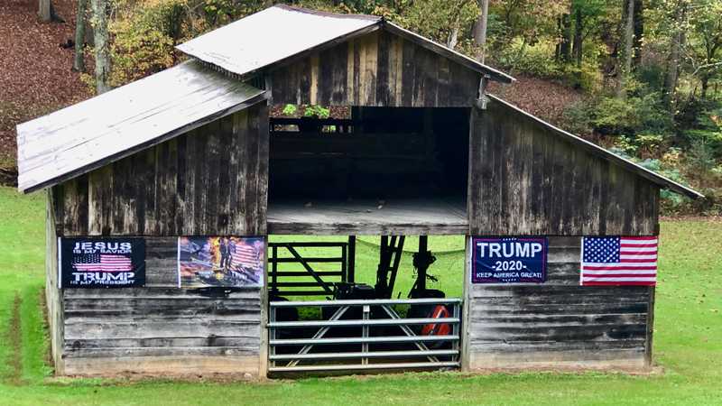 A barn with Trump banners