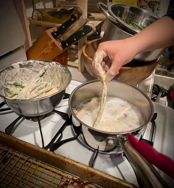 Battering and frying the beans