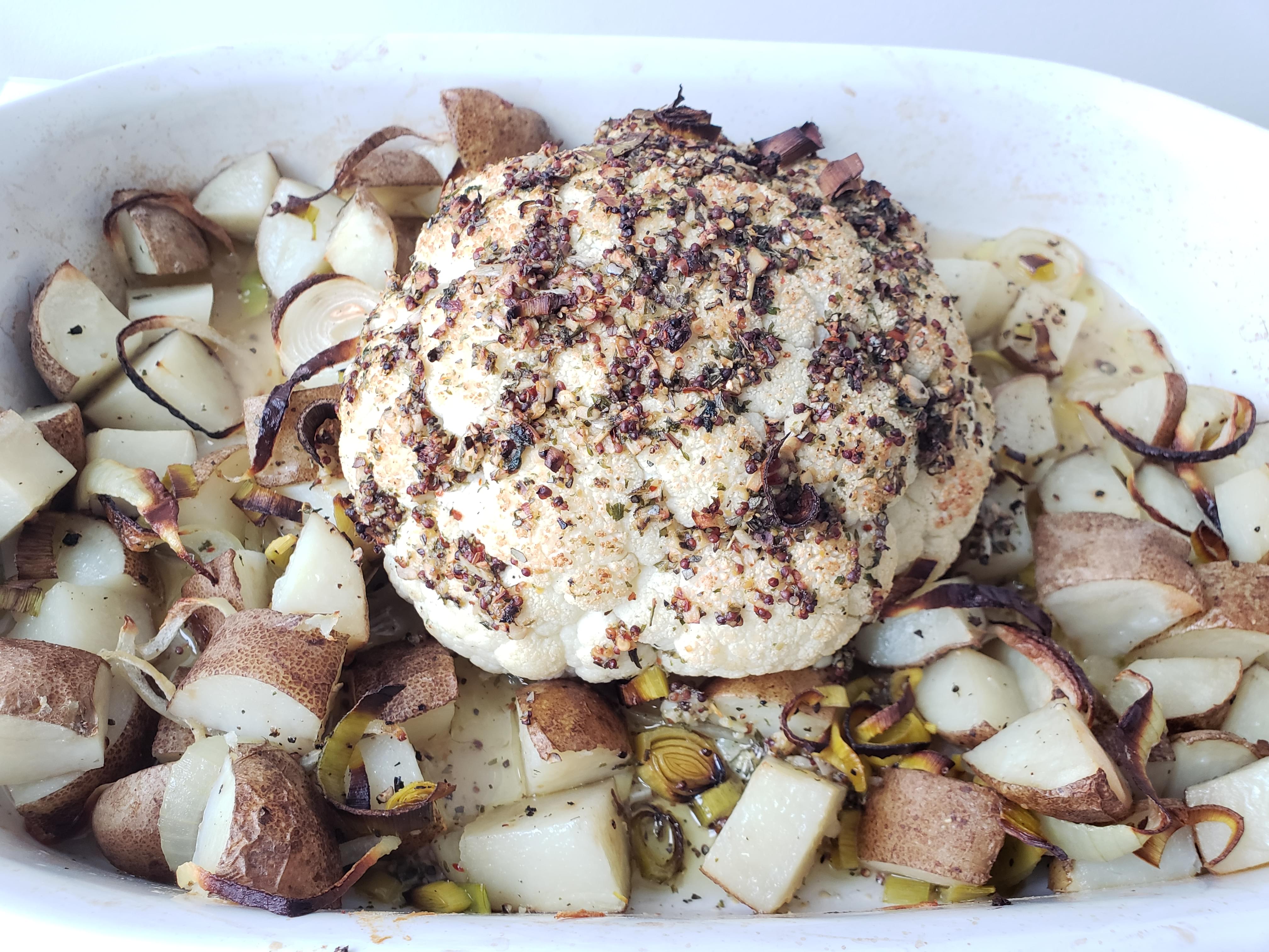 Whole roasted cauliflower and potatoes