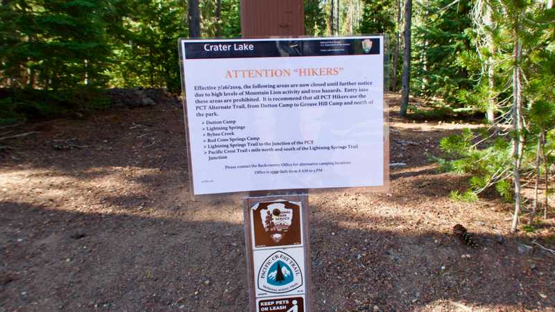 A sign warning of a trail closure in Crater Lake National Park