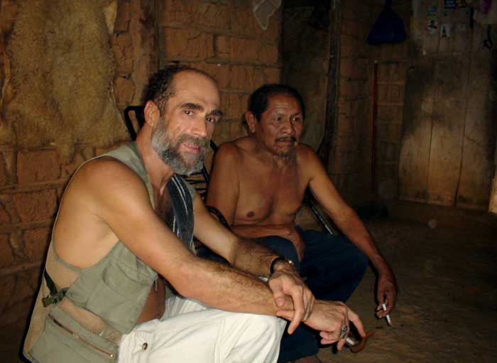 Paolo Pinage (left), who guided the author into the Amazon, rests in the house of a Bakairí Indian during our trip.