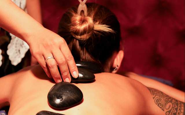 Hot stones massage on location at Casa Asia