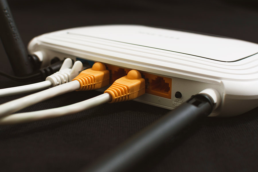 Router with ethernet cords plugged in